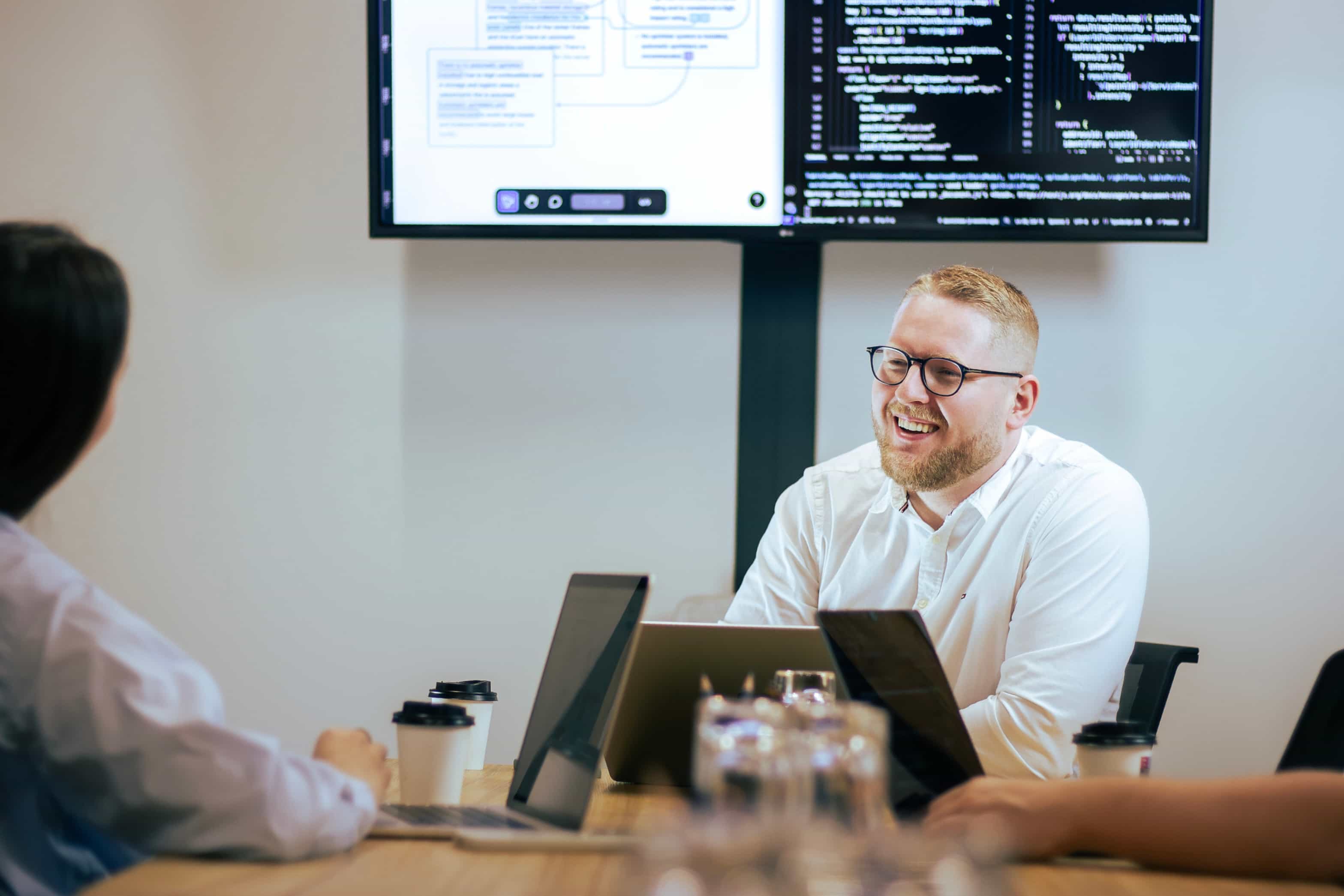 CEO analyzing data visualization dashboard on desktop monitor