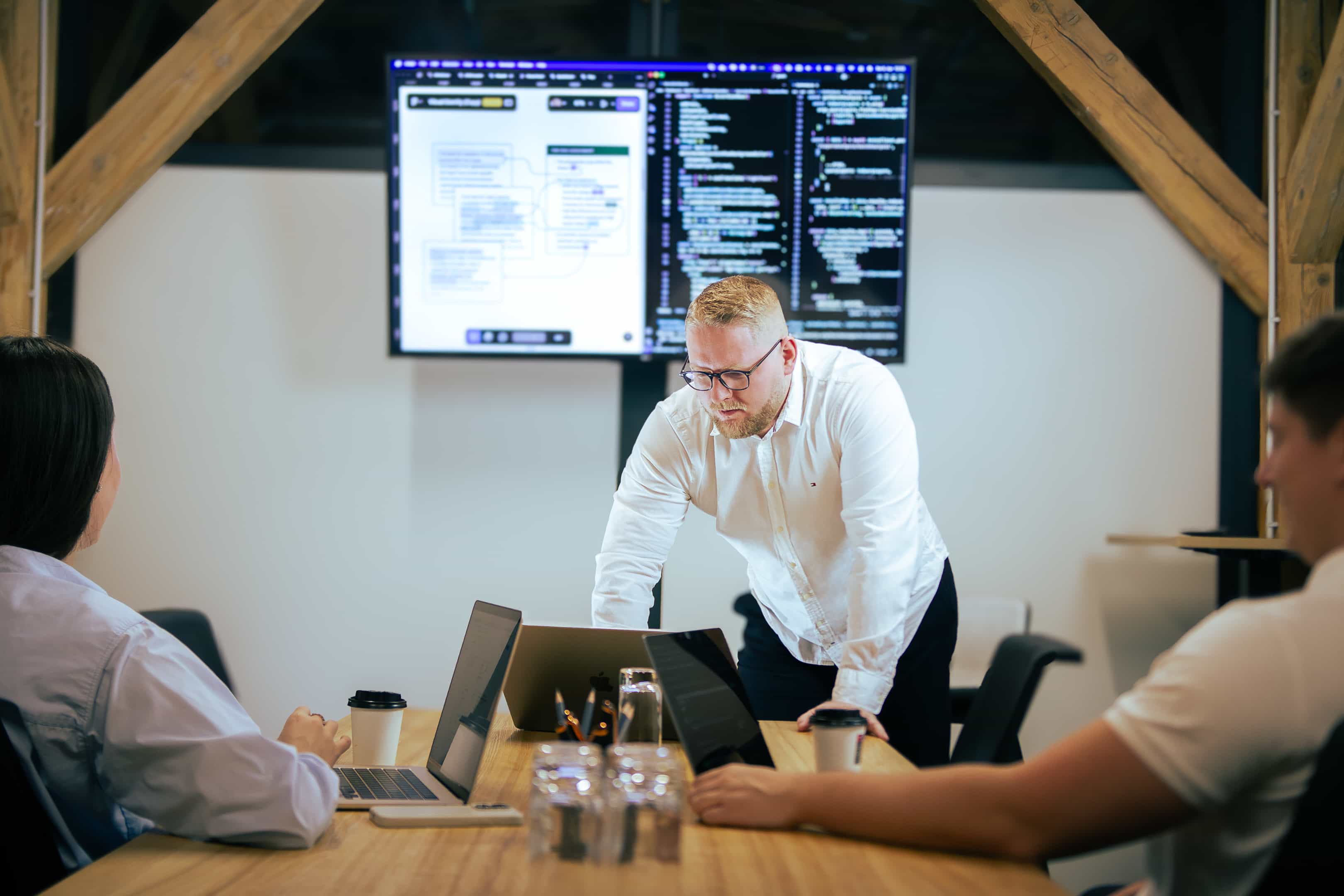 Team members collaborating around a conference table, sharing ideas during a brainstorming session